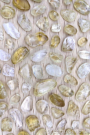 Citrine rare stones texture on light varnished wood background Stock Photo