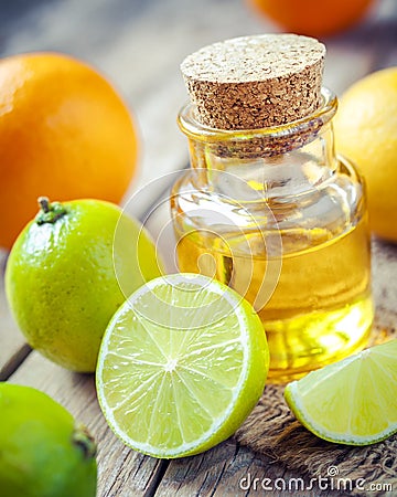 Citrus essential oil and slice of orange, lemon and lime fruits Stock Photo