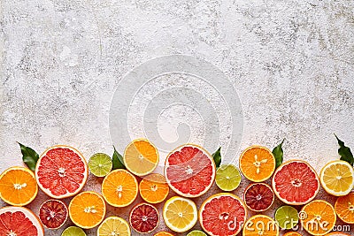 Citrus fruits vegan mix flat lay on white background, helthy vegetarian organic food Stock Photo