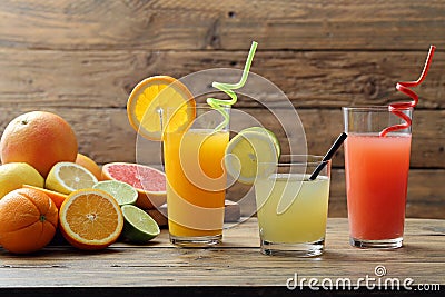 Citrus juice three glasses with orange fruit lemon and grapefruit Stock Photo