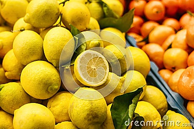 Citrus mix from fresh lemon, tangerine, orange on the farm market. Products rich in vitamins. Stock Photo