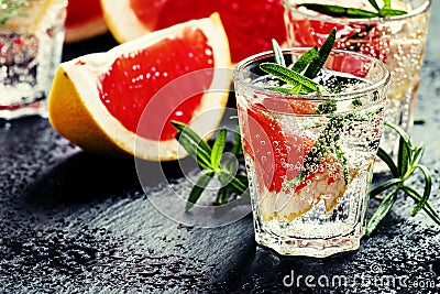 Citrus refreshing lemonade with rosemary and grapefruit, black b Stock Photo