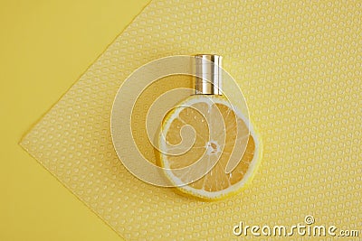 citrus scent, perfume with lemon scent concept, lemon with spray bottle on yellow background Stock Photo