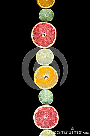 citrus slices, ,orange, lemon, lime and grapefruit black background. Top view Stock Photo