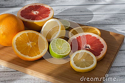 Citruses on a wooden board Stock Photo