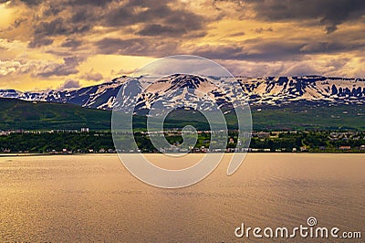 City of Akureyri with snowy mountains and fjord Eyjafjordur in northern Iceland Stock Photo