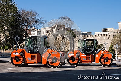 The city of Baku, the Republic of Azerbaijan. 17 April 2017 Close-up view on the road roller working on the new road construction Editorial Stock Photo