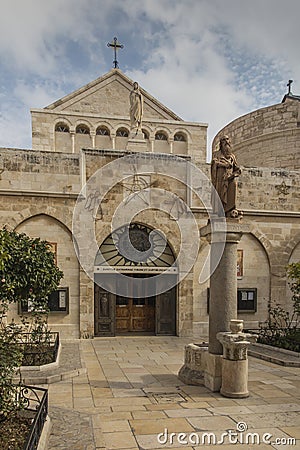 City of Bethlehem. The church Catherine next to the Basilica of the Nativity of Jesus Christ. Column with the figure of Saint Stock Photo