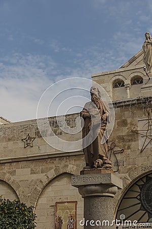 City of Bethlehem. The church Catherine next to the Basilica of the Nativity of Jesus Christ. Column with the figure of Saint Stock Photo