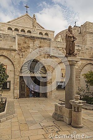 City of Bethlehem. The church Catherine next to the Basilica of the Nativity of Jesus Christ. Column with the figure of Saint Editorial Stock Photo