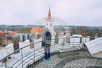 City Cesis, Latvia. Old church and man and tower with man of the new castle Editorial Stock Photo