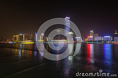 city in china is reflected in the river at night Editorial Stock Photo