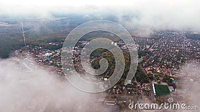City through the clouds. Aerial view of autumn lanscape Stock Photo
