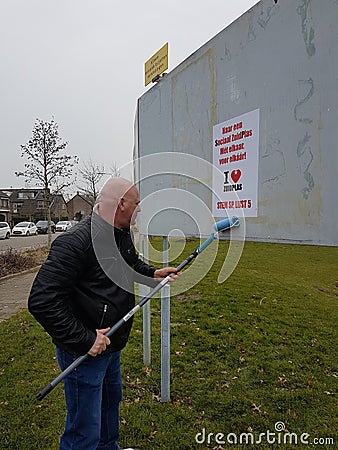 City council elections Netherlands 2018 : Election poster glued on a board in city of Zuidplas by volunteer Editorial Stock Photo