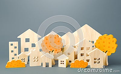 City of figures houses and autumn yellow trees. Real estate concept. Urbanism and infrastructure. Realtor services. Affordable Stock Photo