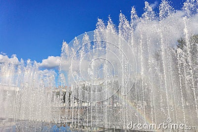 City fountain, water jets with a rainbow on a sunny day Editorial Stock Photo