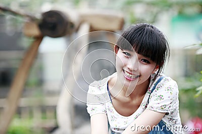 City girl in the farm courtyard. Stock Photo