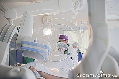 Doctors in the operating room do the surgery. Editorial Stock Photo