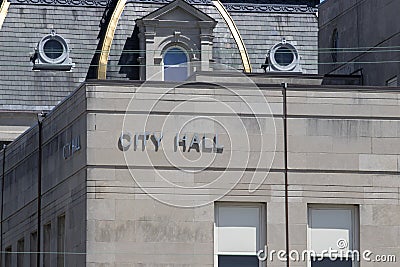 City Hall in silver text set against limestone bricks Stock Photo