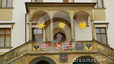 City Hall tower and historic buildings in Olomouc, national coats arms blazon crest shields of statehood of Moravia and Stock Photo