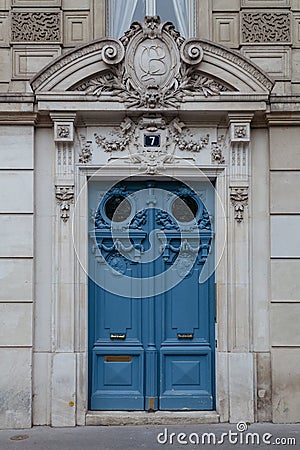 Beautiful vintage blue door in Paris Editorial Stock Photo