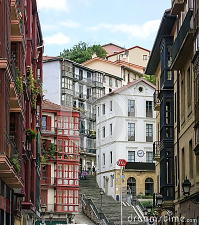 City landscape of a small, cozy street with cascaded houses in Bilbao Stock Photo