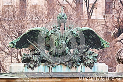 City landscape - view of the bronze statue closeup of the coat of arms of the Austrian empire Stock Photo