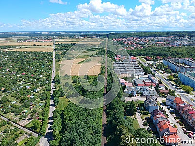 City landscape with wheat fields, forest and countryside, aerial view Stock Photo