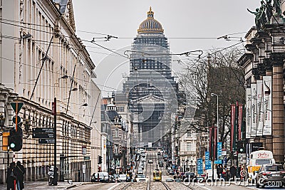 City life and architecture: The busy Rue de la Regence, Zavel neighbourhood, with the Palais de Justice Law Court of Bruxelles Editorial Stock Photo