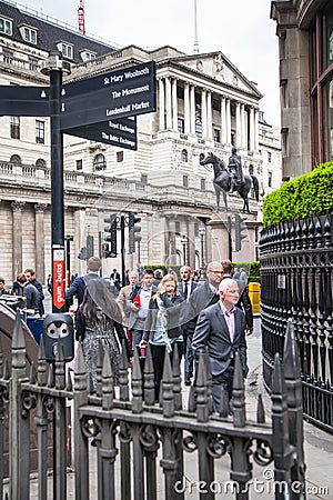 City of London business life. Group of business people walking by the Bank of England Editorial Stock Photo