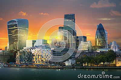 LONDON, City of London view at sunset includes skyscrapers of business aria at sunset. UK Stock Photo