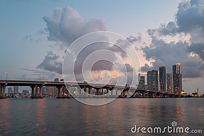 City of Miami Florida, sunset panorama with business and residential buildings and bridge on Biscayne Bay. Skyline night Editorial Stock Photo