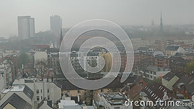 City in the mist, skyline of fog city, critical environment of Air Pollution upon balcony downtown district in Hamburg Germany Stock Photo