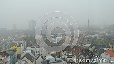 City in the mist, skyline of fog city, critical environment of Air Pollution upon balcony downtown district in Hamburg Germany Stock Photo