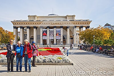 Tourists from China taking pictures with the Russian retired fro Editorial Stock Photo