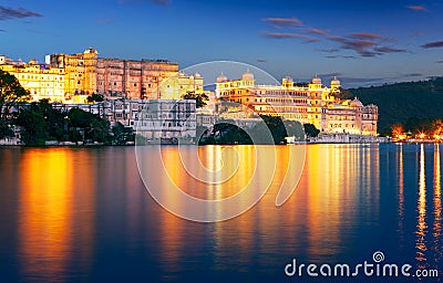 City Palace and Pichola lake at night, Udaipur, Rajasthan, India Stock Photo