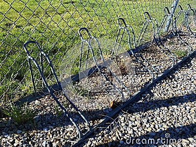 city park bicycle bike lock parking playground rack locked security bikes Stock Photo