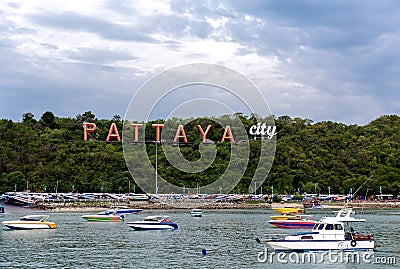City of Pattaya sign with floating boat Stock Photo