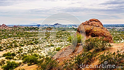 The city of Phoenix in the valley of the Sun seen from the Red Sandstone Buttes in Papago Park Stock Photo