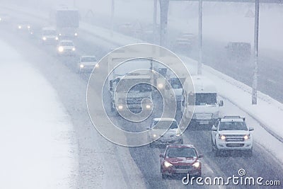 City road traffic in winter in Istanbul Turkey - Traffic in a snowstorm Stock Photo