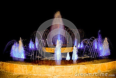 At the city`s fountains, you can rest and relax while looking at the new shapes of the water stream. Multimedia colorful fountain Stock Photo