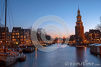 City scenic from Amsterdam with the Montelbaan Tower in the Netherlands at sunset Stock Photo