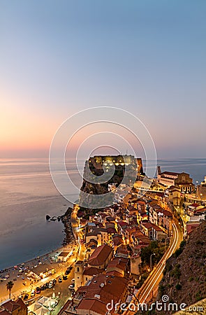 The city of Scilla Calabria Italy. Elevated view of the illuminated Ruffo castle at sunset Stock Photo