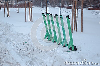 City scooters covered with snow Stock Photo