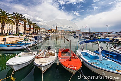 City of Split with colorful fishing boats in harbor, Dalmatia, Croatia. Waterfront view of fishing boats at mediterranean scenery Stock Photo