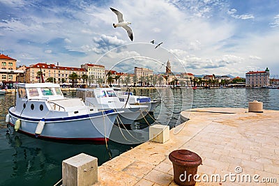 City of Split with colorful fishing boats in harbor, Dalmatia, Croatia. Waterfront view of fishing boats at mediterranean scenery Stock Photo