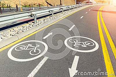 City street asphalt road with separated two way direction bicycle lane route sign mark with white paint. Modern eco Stock Photo