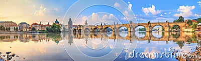 City summer landscape at sunrise, banner - view of the Charles Bridge and the Vltava river in the historical center of Prague Stock Photo