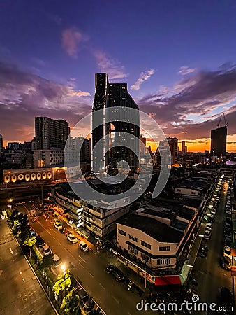 City at the sunset with twilight sky background landscape with building and street light foreground Editorial Stock Photo