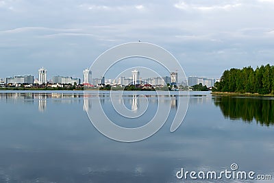 city with tall houses is reflected in the lake Editorial Stock Photo